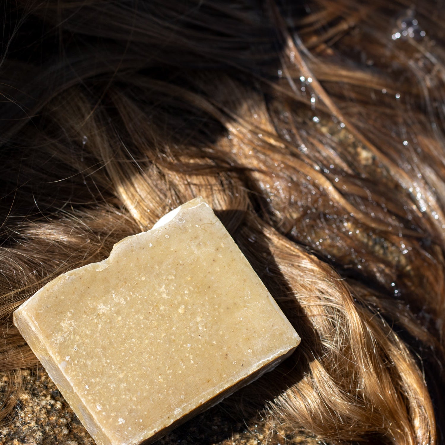 Shampoo Bar of soap on a person's wet hair
